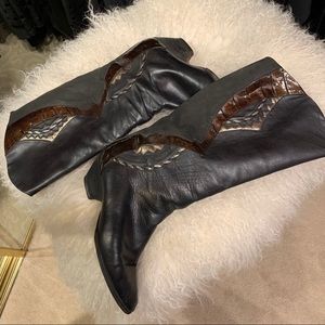 Leather statement boots with side embellishments.